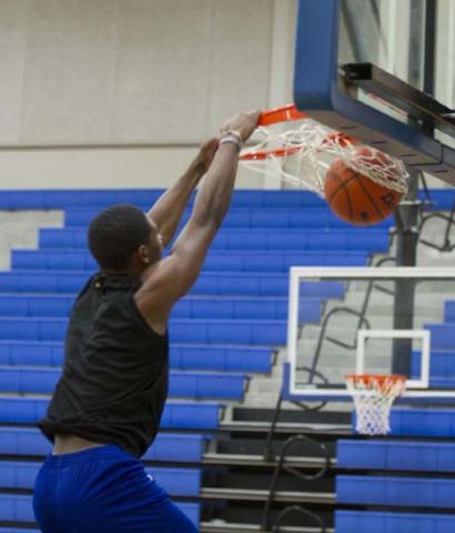Johnki Gardner slams a ball home during practice on Wednesday. HUNTER KING | DISPATCH RECORD