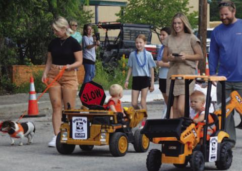 These Pet Parade entrants are riding in style in their “construction” vehicles. Participants are encouraged to dress in costume and embrace the Spring Ho theme -- which this year is “Stars, Stripes and Spring Ho Nights.” FILE PHOTO