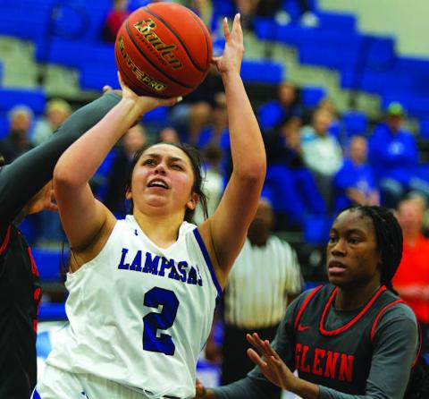 HUNTER KING | DISPATCH RECORD Johnnie Lewis fights through contact for a tough finish against Leander Glenn on Tuesday.