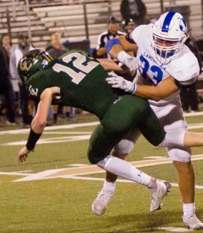 Josh Carter hits Canyon Lake quarterback Peyton McMullen on a pass play last week. Lampasas (4-0 in district, 7-0 overall) will host Fredericksburg (1-3, 5-4) Nov. 6 at 7:30 p.m. JEFF LOWE | DISPATCH RECORD