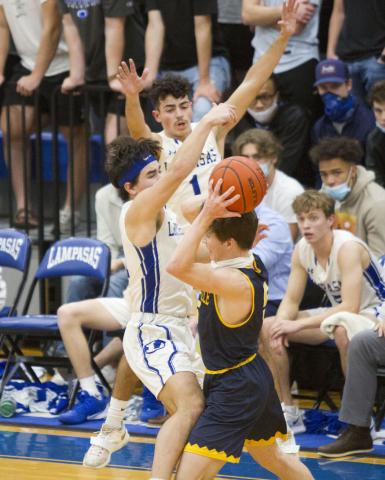 Tak Stinnett, front-left, and Anthony Ortiz close in on a Stephenville player. 