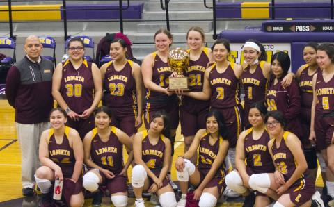 The Lometa Lady Hornets celebrate a bi-district championship victory over Gustine in Early on Saturday. 