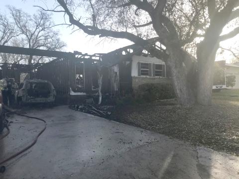 A fire early Monday morning severely damaged a house on Snell Drive. The blaze displaced four people and killed three pets. | Photo by Monique Brand