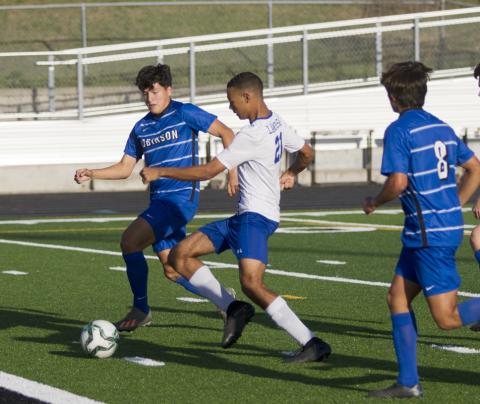 Andrew Grant (21) scores the first goal of Friday's game before an eventual Robinson Rocket comeback. 
