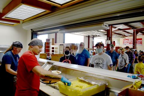 Kempner Volunteer Fire Department firefighters Tracie and Steve Martin serve meals during the department’s annual barbecue and auction fundraiser on Saturday