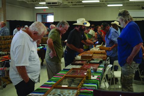 Attendees view offerings at last year's Indian Artifact, Gem, and Mineral Show. FILE PHOTO