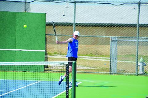 Elijah Copeland follows through on a backhand shot during last week's match. COURTESY PHOTO | KENNETH PEISER