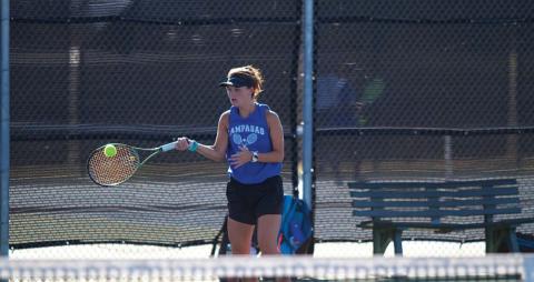 Caroline White plays a forehand shot during her doubles match against Gatesville.