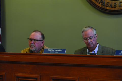 Precinct 3 Commissioner Shad Hill, at left, and County Judge Randy Hoyer listen as information is presented on septic systems. ERICK MITCHELL | DISPATCH RECORD