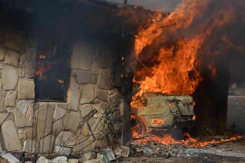 A motor vehicle is engulfed in flames during a structure fire at 778 County Road 4804 on Tuesday afternoon. The incident led to the death of a 71-year-old woman.  ERICK MITCHELL | DISPATCH DISPATCH