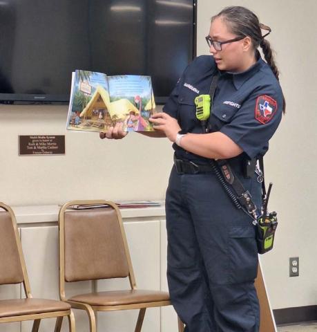 Alyssa Mariduena of the Lampasas Fire Department was one of several community representatives participating in the Aug. 16 “See You at the Library” event. Book reading and fun activities promoted faith, family and freedom.