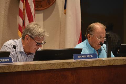 Lampasas EDC Board of Directors Place 7 Michael Irvin and Board President Deorald Finney look on during Wednesday's regular meeting. ERICK MITCHELL | DISPATCH RECORD