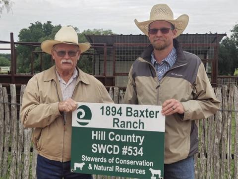 Grady Gibson, left, of Hill Country Soil and Water Conservation District #534, presents Weston McCoury with the Area 5 Conservation Rancher Award for work done on the Baxter Ranch near Bend. COURTESY PHOTO