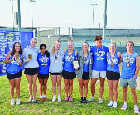 The tennis team shows off their medals from Marble Falls. HUNTER KING | DISPATCH RECORD