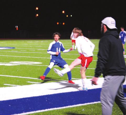 Tyler Ecker puts a foot into a challenge against Salado on Friday night. Head coach Samuel Burnside looks on. HUNTER KING | DISPATCH RECORD