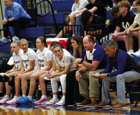 	The Lady Badgers and their coaches look on during Tuesday’s game against Rogers.