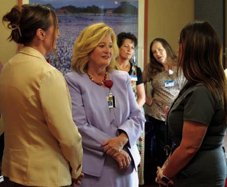 AdventHealth Central Texas President/CEO Jennifer Swenson, center, visits with local residents during Thursday’s open house at Rollins Brook hospital. ERICK MITCHELL | DISPATCH RECORD