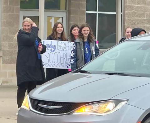 The Lampasas High School Lady Badger soccer team welcomes students arriving at Taylor Creek Elementary. courtesy photo
