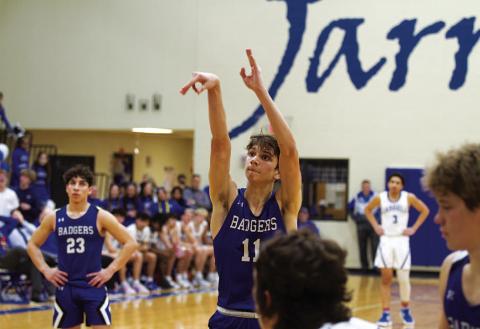 HUNTER KING | DISPATCH RECORD Luke Shivers releases a free throw for one of his 10 points in Tuesday’s game.