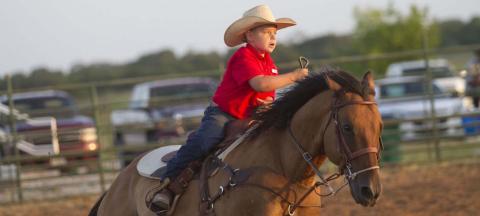 A rider at the Lometa FFA Junior Rodeo takes a lap around the Bar 3 Arena on Friday night as the rodeo gets underway. HUNTER KING | DISPATCH RECORD