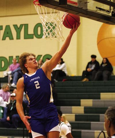 HUNTER KING | DISPATCH RECORD Haegan Oncken lays the ball up during the second half against Taylor.