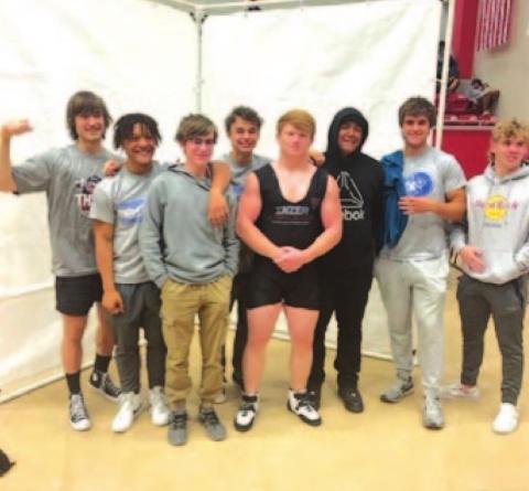 The powerlifting team poses together after competing at the regional meet last week. COURTESY PHOTO