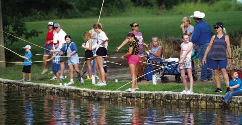 Lampasas youth show up in numbers for the opportunity to catch some fish in the park. FILE PHOTO