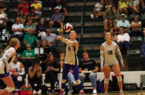 Caitlyn Bengsch plays a pass during the match against Burnet. HUNTER KING | DISPATCH RECORD
