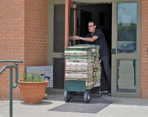 Kofile Premium Services representatives were in Lampasas in June to transport 30 years’ worth of deed records and index books from the Lampasas County Clerk’s Office to its headquarters in Dallas where digitization of the records has taken place. file photo