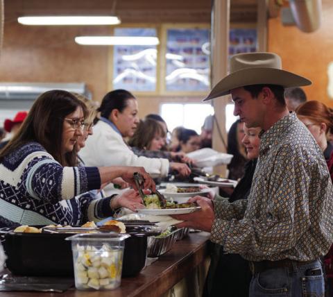 ADAM BARRIOS | DISPATCH RECORD Before the premium sale, attendees were served a steak dinner during Saturday evening’s activities.