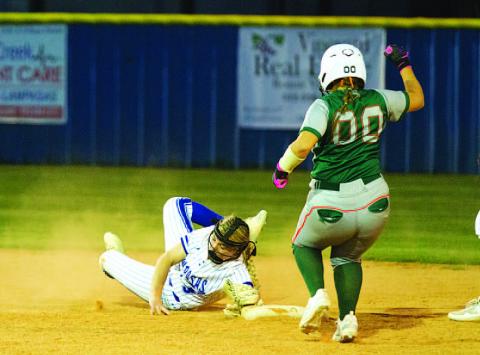 HUNTER KING | DISPATCH RECORD Brady Burton dives to touch second base to record an out in Tuesday’s contest.