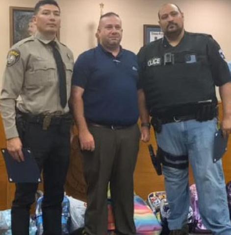 Kempner Mayor John Wilkerson, center, honors Lampasas County Sheriff’s Office Deputy Raymond Barrera, left, and Interim Chief of Police Heriberto “Eddie” Rodriguez during the Kempner City Council’s meeting July 27. CITY OF KEMPNER FACEBOOK