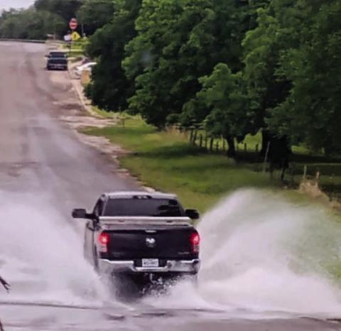 A pickup drives across the low-water crossing on South Willis in west Lampasas Tuesday. The county has received more than five inches of precipitation this month. COURTESY PHOTO