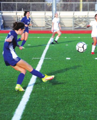 Nyla Long puts in a cross from the right wing during the Lady Badgers’ first district win over Jarrell. HUNTER KING | DISPATCH RECORD