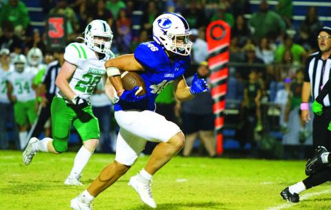 Haegan Oncken breaks toward the end zone on his second touchdown of the game last Friday. HUNTER KING | DISPATCH RECORD