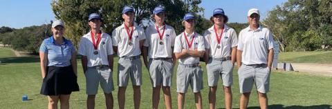 COURTESY PHOTO | GARRY SPORE Members of the Badger golf team pose with their second-place medals.