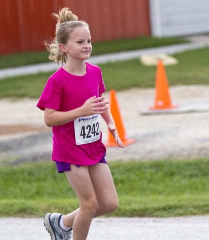 2016 Little Miss Spring Ho Vivien Martin won the female division of the one-mile race. JEFF LOWE | DISPATCH RECORD