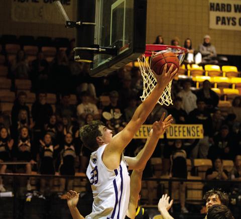 HUNTER KING | DISPATCH RECORD Beau Patterson rises up to finish two of his 22 points in Tuesday’s playoff game.