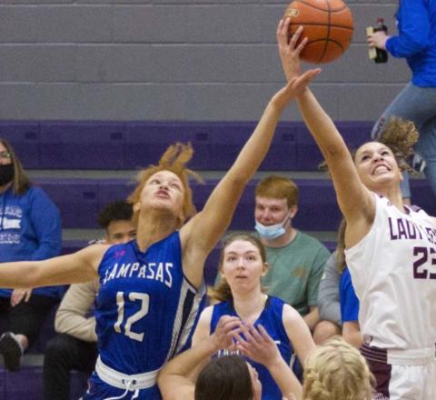 First-team all-district pick Juliana Dwamena (12) stretches for control of the ball in a play-in game against Brownwood. Taylor Allen, in middle, was a second-team all-district selection. JEFF LOWE | DISPATCH RECORD