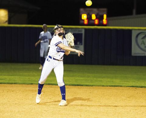 HUNTER KING | DISPATCH RECORD Brady Burton throws to first base to record an out against Taylor.
