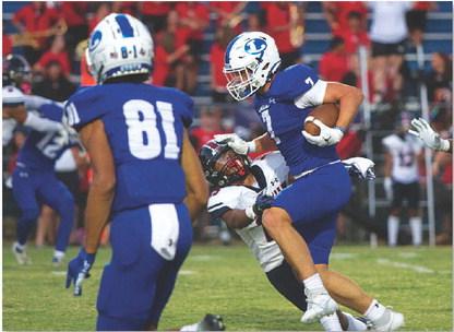 Jett Walker stiff arms an East View defender. The sophomore ran for 166 yards and two touchdowns. HUNTER KING | DISPATCH RECORD