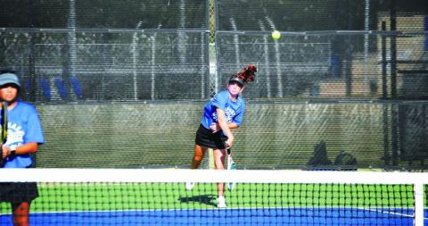 Allison Valdez serves during her doubles match against Gatesville. HUNTER KING | DISPATCH RECORD