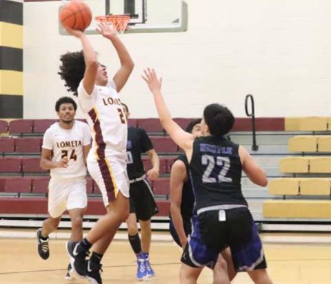 Tim Juarez goes up over a San Angelo Lakeview defender during the Hornets’ loss last week. JESSICA MALDONADO | DISPATCH RECORD