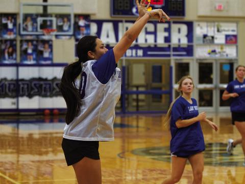 HUNTER KING | DISPATCH RECORD Johnnie Lewis releases a three-point shot during a practice this week.