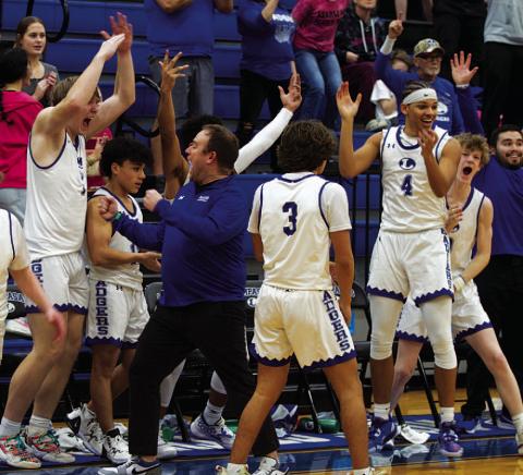 HUNTER KING | DISPATCH RECORD Head coach Aaron Nuckles and his team erupt in celebration as the final seconds ticked off the clock.