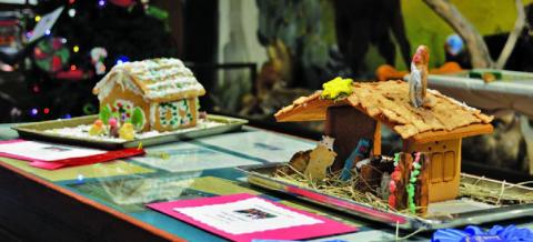 At right, the “Away in a Manger” gingerbread house created by Kylee Davis earned first place in the 8- to 12-year-olds division, while the “Carolers” house to the left made by Gwendolyn Martin earned second. ERICK MITCHELL | DISPATCH RECORD