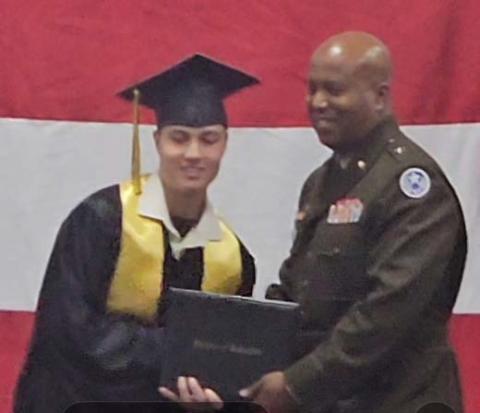 John W. Harvey III graduated in December from the Texas Challenge Academy, a residential military program sponsored by the Texas National Guard. He is pictured with the commencement speaker, who presented his diploma. courtesy photo