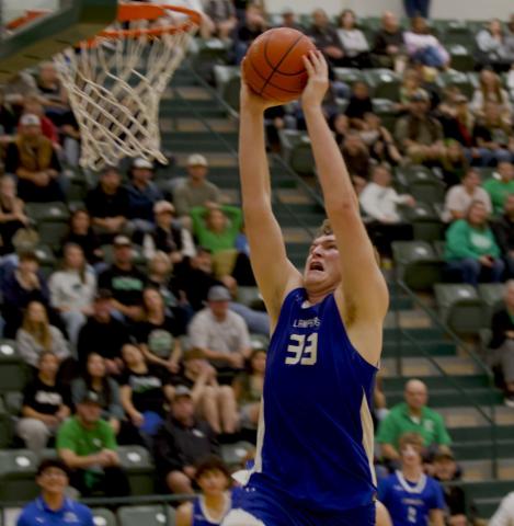 Beau Patterson rises up for the exclamation point slam dunk to finish off the win over Burnet on Friday. HUNTER KING | DISPATCH RECORD