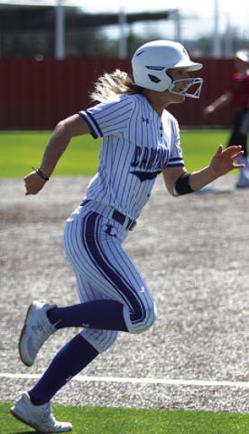 Bre Quarles heads home to score a run for the Lady Badgers. HUNTER KING | DISPATCH RECORD