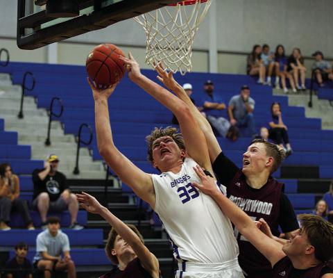 HUNTER KING | DISPATCH RECORD Beau Patterson finishes through contact from Brownwood defenders.